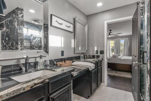 a bathroom with two sinks and a shower at Spacious Entire Home 4B & 2.5B in Avondale Arizona in Avondale