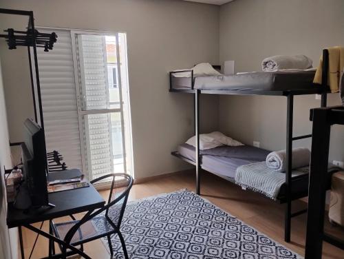 Postel nebo postele na pokoji v ubytování Hostel Magalhães