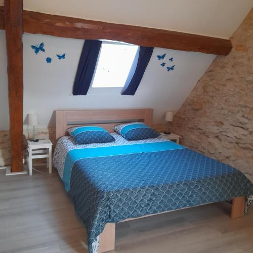 Postel nebo postele na pokoji v ubytování Le Bleuet
