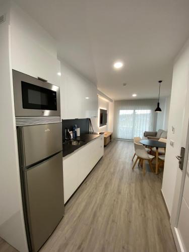 Dapur atau dapur kecil di Apartamentos Riveiro
