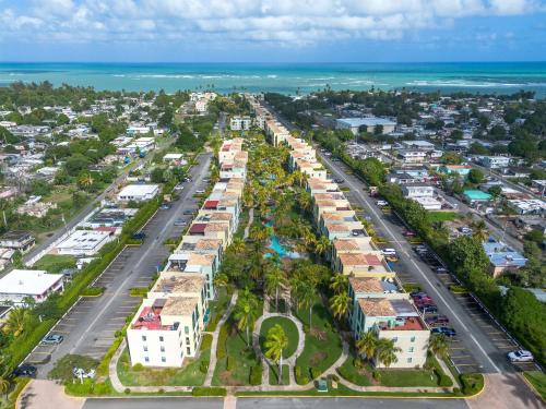 an aerial view of a city with houses and the ocean at Paradise at Aquatika Poolfront with Private Beach in Vieques