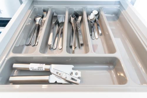 a drawer filled with utensils in a refrigerator at Comfortable stay in Shirley, Solihull - Room-2 in Solihull