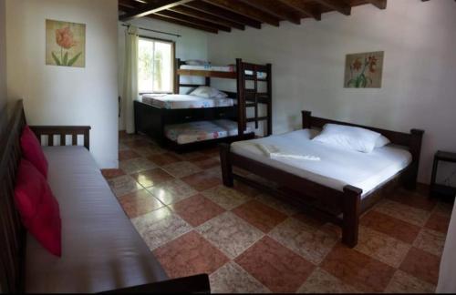 Ein Bett oder Betten in einem Zimmer der Unterkunft Hotel Palma Real