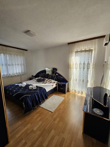 a bedroom with a bed and a television in it at Holiday Home Peaceful Retreat in Visoko