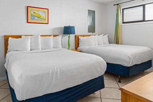 a hotel room with two beds and a window at Spacious 1 BR Condo- Stunning Ocean Views- Meridian 605 in Myrtle Beach