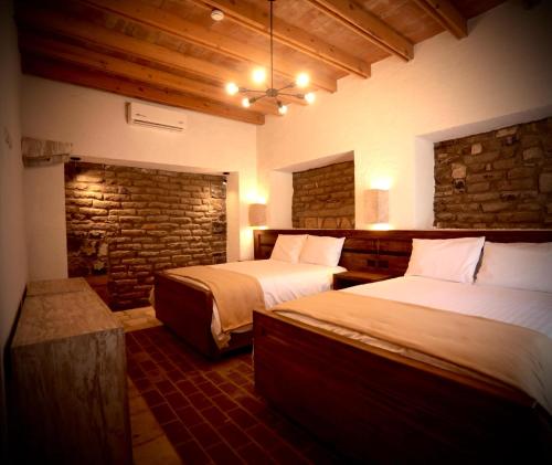 Ένα ή περισσότερα κρεβάτια σε δωμάτιο στο Hotel Villa de la Parra