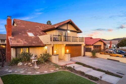 a house with a driveway and a yard at Mira Mesa Family Retreat 4BR with Balcony and Firepit in San Diego