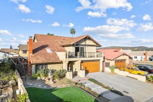 an aerial view of a house with a yard at Mira Mesa Family Retreat 4BR with Balcony and Firepit in San Diego