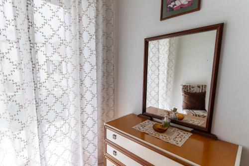 a mirror on top of a dresser in a room at CristallPont Amalfi Day in Atrani