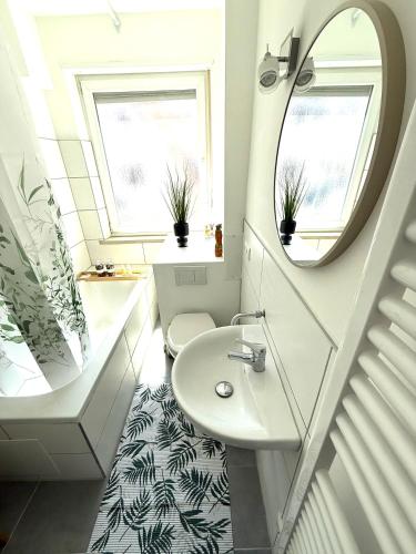 a bathroom with a sink and a mirror at 2 ZKB-3OG oder 3 ZKB-UG im Zentrum zw Rathaus und Dom in Augsburg
