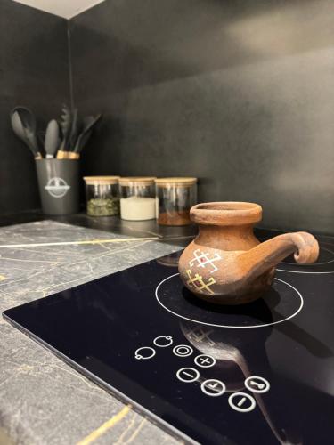 a vase sitting on top of a counter with other items at DiliNest near UWC College in Dilijan