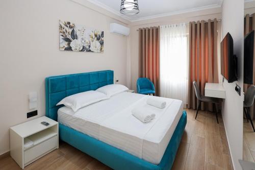 Postel nebo postele na pokoji v ubytování Saliasi hotel&apartament