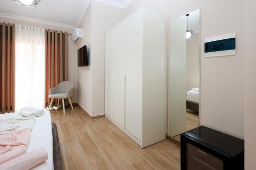 Postel nebo postele na pokoji v ubytování Saliasi hotel&apartament