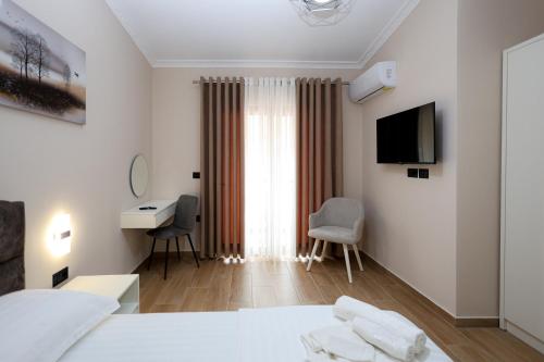 TV a/nebo společenská místnost v ubytování Saliasi hotel&apartament