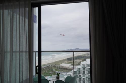a view of the beach from a hotel room window at The Lagoon Cam Ranh - Your Perfect Getaway - Free room upgrade in Cam Ranh International Airport