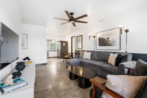 a living room with a couch and a table at San Diego Chill House with Jacuzzi-Golf-Game Room in San Diego