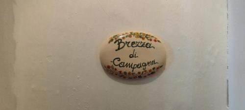 a doughnut with writing on it on a wall at Dimora Maltese in Morciano di Leuca
