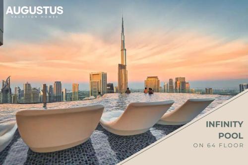 a view of the dubai skyline from the infinity pool at Luxury Seaview 2BR - Paramount Midtown - 6 Guests - 64F Pool Access & Burj View in Dubai