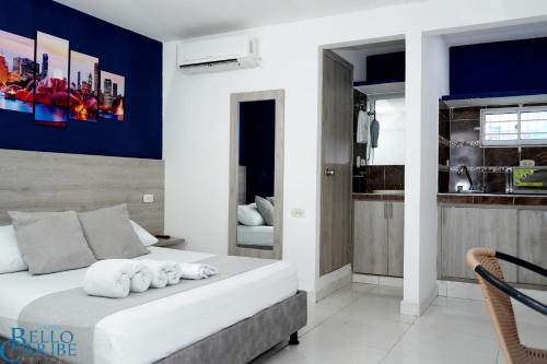 a bedroom with a bed with towels on it at Hotel Bello Caribe Rodadero in Santa Marta