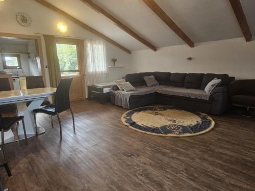 a living room with a couch and a table at Apartments Šeherzada in Pula