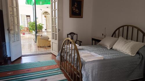 Ένα ή περισσότερα κρεβάτια σε δωμάτιο στο Casa grande 2 Rosa