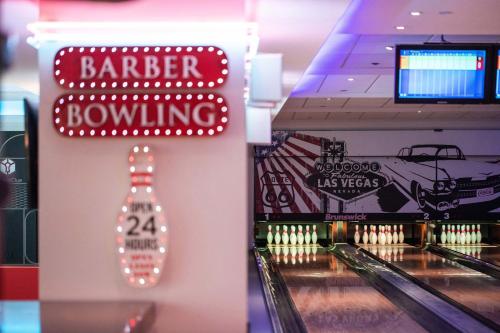 a bowling alley with a sign forller bowling at The Westin Resort, Costa Navarino in Romanós