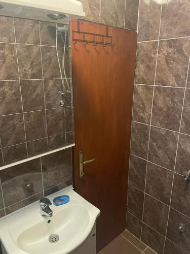 a bathroom with a sink and a shower at New house in Dobra Voda