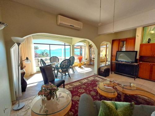 a living room with a couch and a table at Villa Hermosa Ocean View 2 Bed in San Carlos
