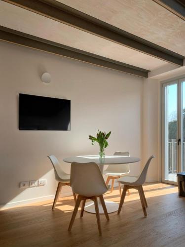 a dining room with a table and chairs at Spazio Perlasca Apt 3 - Cernobbio Como Lake in Cernobbio