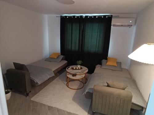 Ένα ή περισσότερα κρεβάτια σε δωμάτιο στο A&A Apartments