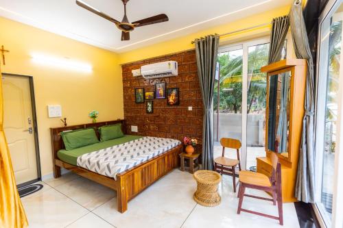a bedroom with a bed and a window at Riverside Retreat in Kalyānpur