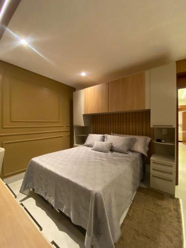 a bedroom with a large bed in a room at Casa em condomínio Campina Grande in Campina Grande