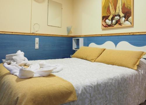 Postel nebo postele na pokoji v ubytování Hostal El Cartero