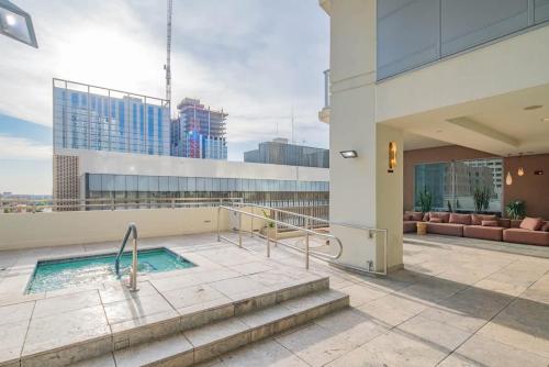 a swimming pool on the roof of a building at Stunning 2BR DT HighRise, Gym, Pool, W-D, Parking, Golf in Phoenix