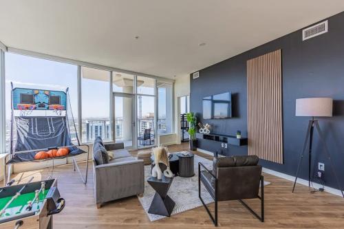 a living room filled with furniture and a pool table at Luxury 28th Floor High Rise, Gym, Parking, Pool, Golf in Phoenix