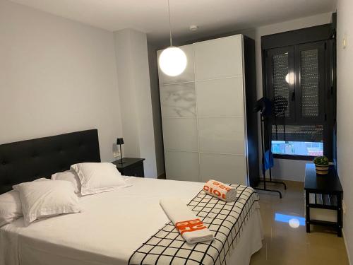 a bedroom with a bed with two toy trains on it at Apartamento Aguadulce in Aguadulce