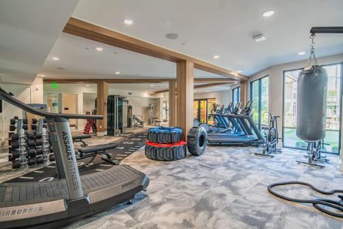 an indoor gym with treadmills and weights at Serene 1BR Uptown Biltmore Gym Pool Parking WD in Phoenix