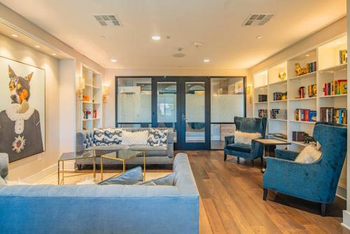 a living room with a blue couch and chairs at Serene 1BR Uptown Biltmore Gym Pool Parking WD in Phoenix