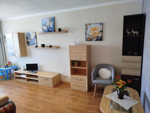 a living room with a desk and a chair at FourSpace in Ventspils