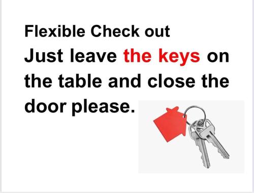a pair of keys on a white background at Julie's AIRPORT Apartment in Marrakech