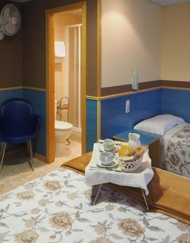 Postel nebo postele na pokoji v ubytování Hostal El Cartero