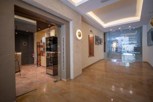 a hallway of a store with a large glass door at Hotel La Grava in El Morell