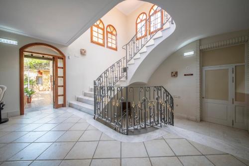a staircase in a house with a door at Hotel La Grava in El Morell