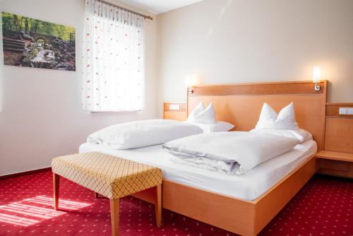 Postel nebo postele na pokoji v ubytování Hotel & Restaurant Post