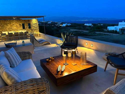 a living room with a couch and a table at VILLA CHRISTINA-Soros beach, Antiparos in Andiparos