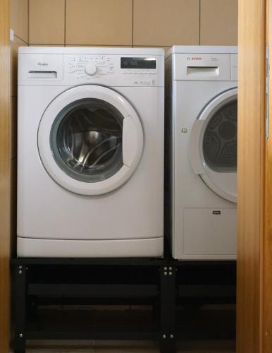 two washing machines are sitting next to each other at Holiday home in a top location in Ferlach
