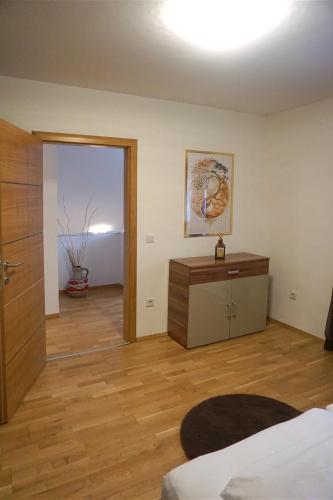 a room with a bed and a wooden floor at Holiday home in a top location in Ferlach