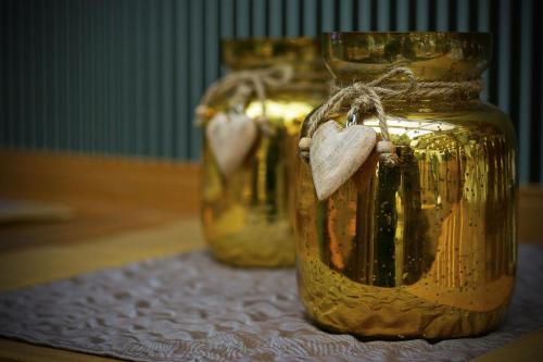 a group of three jars with hearts in them at Xavin Wellness Hotel & Restaurant in Harkány