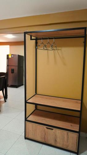 a shelf with pairs of scissors in a room at Hotel y Cabañas Covemar in Coveñas