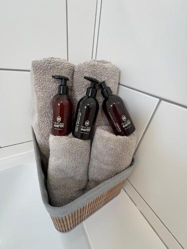 a basket with three hair dryers on a wall at 175 A on Uniab Close in Langstrand